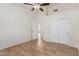 Bedroom with double door closet and tile floor at 13345 W Cypress St, Goodyear, AZ 85395