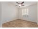 Bright bedroom with ceiling fan and tile floor at 13345 W Cypress St, Goodyear, AZ 85395