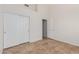 Bedroom with double door closet and tile floor at 13345 W Cypress St, Goodyear, AZ 85395