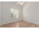 Bedroom with ceiling fan and tile floor at 13345 W Cypress St, Goodyear, AZ 85395