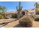 One-story house with desert landscaping, featuring a terracotta tile roof and neutral color scheme at 13345 W Cypress St, Goodyear, AZ 85395