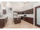 Modern kitchen with island and stainless steel appliances at 13345 W Cypress St, Goodyear, AZ 85395