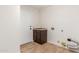 Laundry room with sink and dark brown cabinets at 13345 W Cypress St, Goodyear, AZ 85395