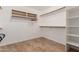 Large walk-in closet with shelving and hanging rods at 13345 W Cypress St, Goodyear, AZ 85395