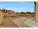 Large backyard with a rock perimeter, brick patio and a high block wall at 13441 W Rose Ln, Litchfield Park, AZ 85340