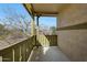 Covered balcony area with views of trees and nearby houses at 13441 W Rose Ln, Litchfield Park, AZ 85340