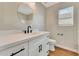 Bathroom vanity featuring a white countertop and dark hardware at 13441 W Rose Ln, Litchfield Park, AZ 85340