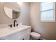 Modern bathroom with white vanity and updated fixtures at 13441 W Rose Ln, Litchfield Park, AZ 85340