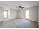 Upstairs bedroom with carpet and ceiling fan at 13441 W Rose Ln, Litchfield Park, AZ 85340