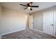 Bedroom with ceiling fan and carpet at 13441 W Rose Ln, Litchfield Park, AZ 85340