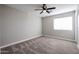 Upstairs bedroom with carpet and ceiling fan at 13441 W Rose Ln, Litchfield Park, AZ 85340