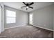 Bedroom with private balcony access and ceiling fan at 13441 W Rose Ln, Litchfield Park, AZ 85340