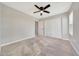 Spacious bedroom featuring carpet and a ceiling fan at 13441 W Rose Ln, Litchfield Park, AZ 85340