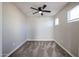 Cozy bedroom with ceiling fan and carpet floors at 13441 W Rose Ln, Litchfield Park, AZ 85340