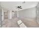 Light-filled bonus room boasting neutral decor, ceiling fan, and arched doorways at 13441 W Rose Ln, Litchfield Park, AZ 85340