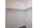 Large walk-in closet with double hanging rods at 13441 W Rose Ln, Litchfield Park, AZ 85340