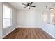 Charming dining area with hardwood floors and ceiling fan at 13441 W Rose Ln, Litchfield Park, AZ 85340