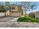 Charming two-story home features a well-manicured lawn, attached garage, and inviting facade at 13441 W Rose Ln, Litchfield Park, AZ 85340