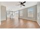 Spacious living room with ample natural light, laminate flooring, and an open layout at 13441 W Rose Ln, Litchfield Park, AZ 85340