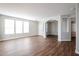 Bright living room with hardwood floors and large windows at 13441 W Rose Ln, Litchfield Park, AZ 85340