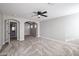 Main bedroom featuring carpet, high ceilings and ensuite bathroom at 13441 W Rose Ln, Litchfield Park, AZ 85340