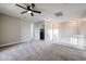 Upstairs hallway with carpet and access to laundry at 13441 W Rose Ln, Litchfield Park, AZ 85340