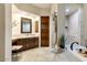 Elegant bathroom featuring a soaking tub, shower, and vanity at 13462 E Wethersfield Rd, Scottsdale, AZ 85259