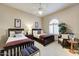 Guest bedroom with two twin beds and a ceiling fan at 13462 E Wethersfield Rd, Scottsdale, AZ 85259