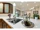 Modern kitchen with stainless steel appliances and white countertops at 13462 E Wethersfield Rd, Scottsdale, AZ 85259