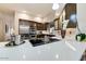 Bright kitchen featuring stainless steel appliances and dark wood cabinets at 13462 E Wethersfield Rd, Scottsdale, AZ 85259