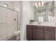 Clean bathroom with shower, toilet, vanity, and mirror at 14104 W Bronco Trl, Surprise, AZ 85387