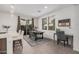 Kitchen with an island and adjoining dining area with a wooden table at 14104 W Bronco Trl, Surprise, AZ 85387