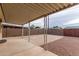 Covered patio, large backyard, and storage shed at 1416 S Lawther Dr, Apache Junction, AZ 85120