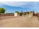 Backyard view with patio, storage shed, and fence at 1416 S Lawther Dr, Apache Junction, AZ 85120