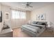 Main bedroom with staged furniture and ceiling fan at 1416 S Lawther Dr, Apache Junction, AZ 85120