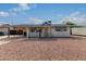 Ranch style home with carport and gravel landscaping at 1416 S Lawther Dr, Apache Junction, AZ 85120