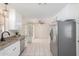 Modern kitchen with white cabinets and stainless steel appliances at 1416 S Lawther Dr, Apache Junction, AZ 85120