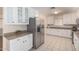 Modern kitchen with white cabinets and stainless steel appliances at 1416 S Lawther Dr, Apache Junction, AZ 85120