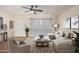 Living room with L-shaped sofa, coffee table, and ceiling fan at 1416 S Lawther Dr, Apache Junction, AZ 85120