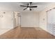 Hardwood floor living room with ceiling fan and access to hallway at 1416 S Lawther Dr, Apache Junction, AZ 85120