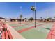 Community shuffleboard courts with seating areas at 1416 S Lawther Dr, Apache Junction, AZ 85120