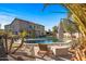 Stunning backyard oasis with pool, spa, and putting green at 16118 W Gibson Ln, Goodyear, AZ 85338