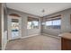 Bright dining room with door leading to the backyard and large windows at 16118 W Gibson Ln, Goodyear, AZ 85338