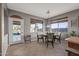 Dining area with a table and chairs, and access to the backyard at 16118 W Gibson Ln, Goodyear, AZ 85338