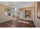 Elegant dining room with hardwood floors and access to kitchen at 16118 W Gibson Ln, Goodyear, AZ 85338