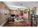 Upstairs game room features hardwood floors, a ceiling fan, and plenty of space for entertainment at 16118 W Gibson Ln, Goodyear, AZ 85338