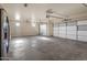 Spacious garage with double doors and overhead storage at 16118 W Gibson Ln, Goodyear, AZ 85338