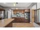 Kitchen with stainless steel appliances and wood cabinets at 16118 W Gibson Ln, Goodyear, AZ 85338