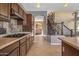 Kitchen with a view of the staircase and Gathering room at 16118 W Gibson Ln, Goodyear, AZ 85338