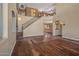 Two-story living room with hardwood floors and an open floor plan at 16118 W Gibson Ln, Goodyear, AZ 85338